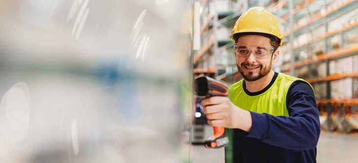 Employee scanning aluminium products.