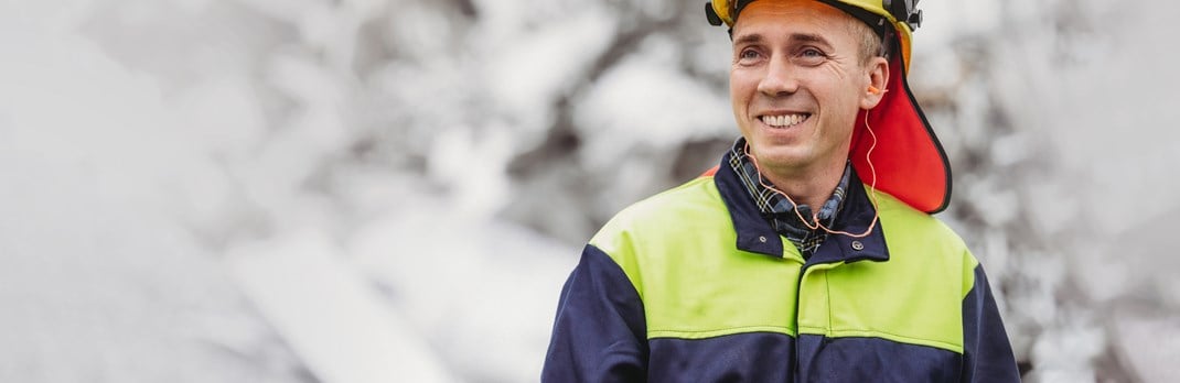 Smiling employee at an aluminium scrap yard.